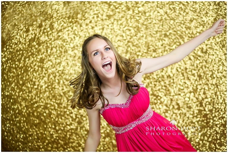 Happy teen in red dress in sparkly background